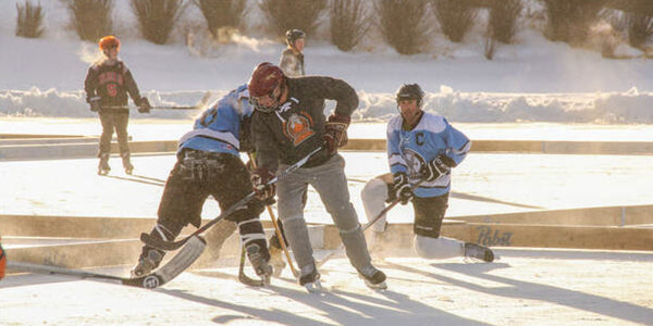 Image of participants at the Pabst Colorado Pond Hockey Tournament.