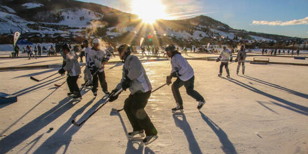Players on the ice at the Pabst Colorado Pond Hockey Tournament.
