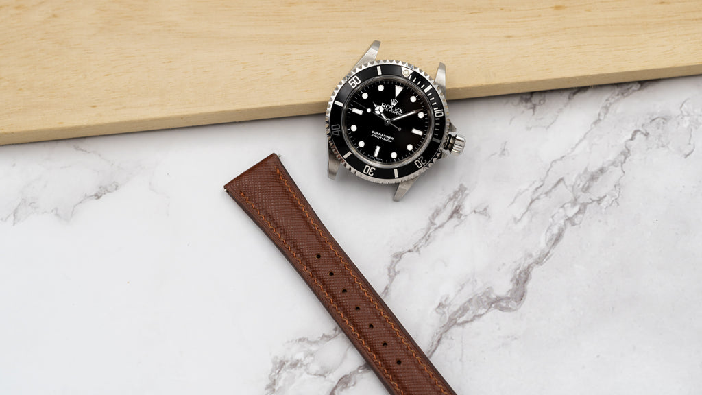 Black Rolex Submariner with Strapatelier's Saffiano Padded Strap