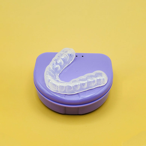 A dental guard on its case