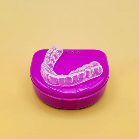 A custom dental guard placed over its case