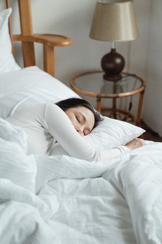 a girl sleeping on the bed