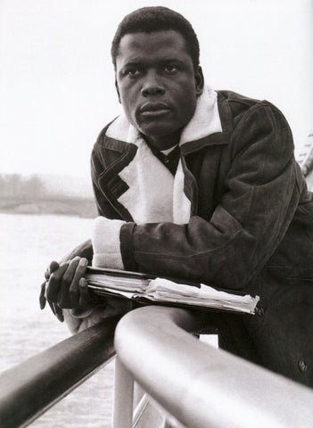 A casual Sidney Poitier on a boat. (B&W)