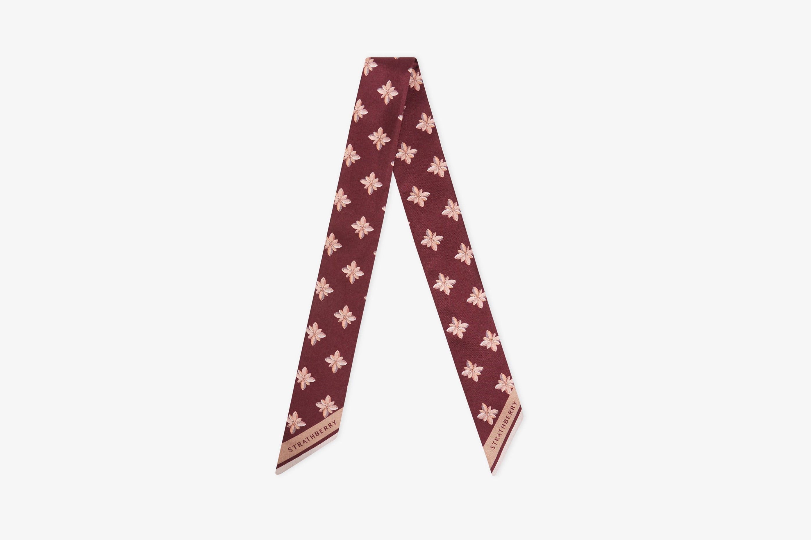 A view showcasing our Silk Skinny Scarf - Bead Print Burgundy