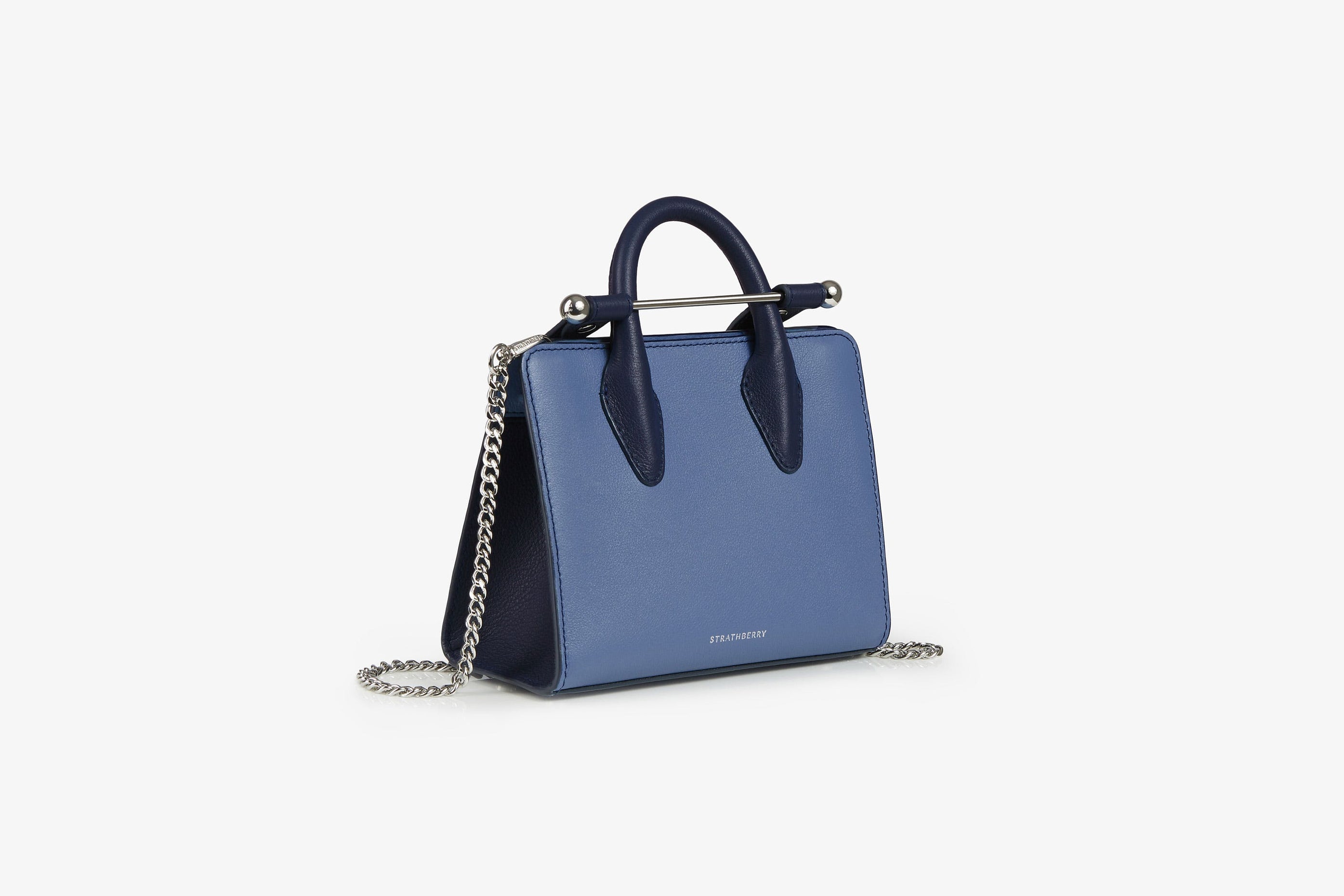 A view showcasing our The Strathberry Nano Tote - Navy/Sea Blue with Silver Hardware