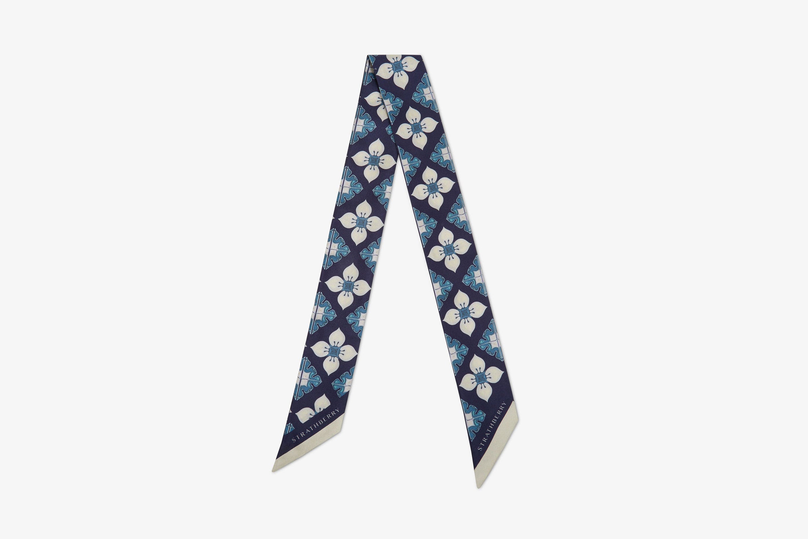 A view showcasing our Silk Skinny Scarf - Ceramica Print Navy Mix