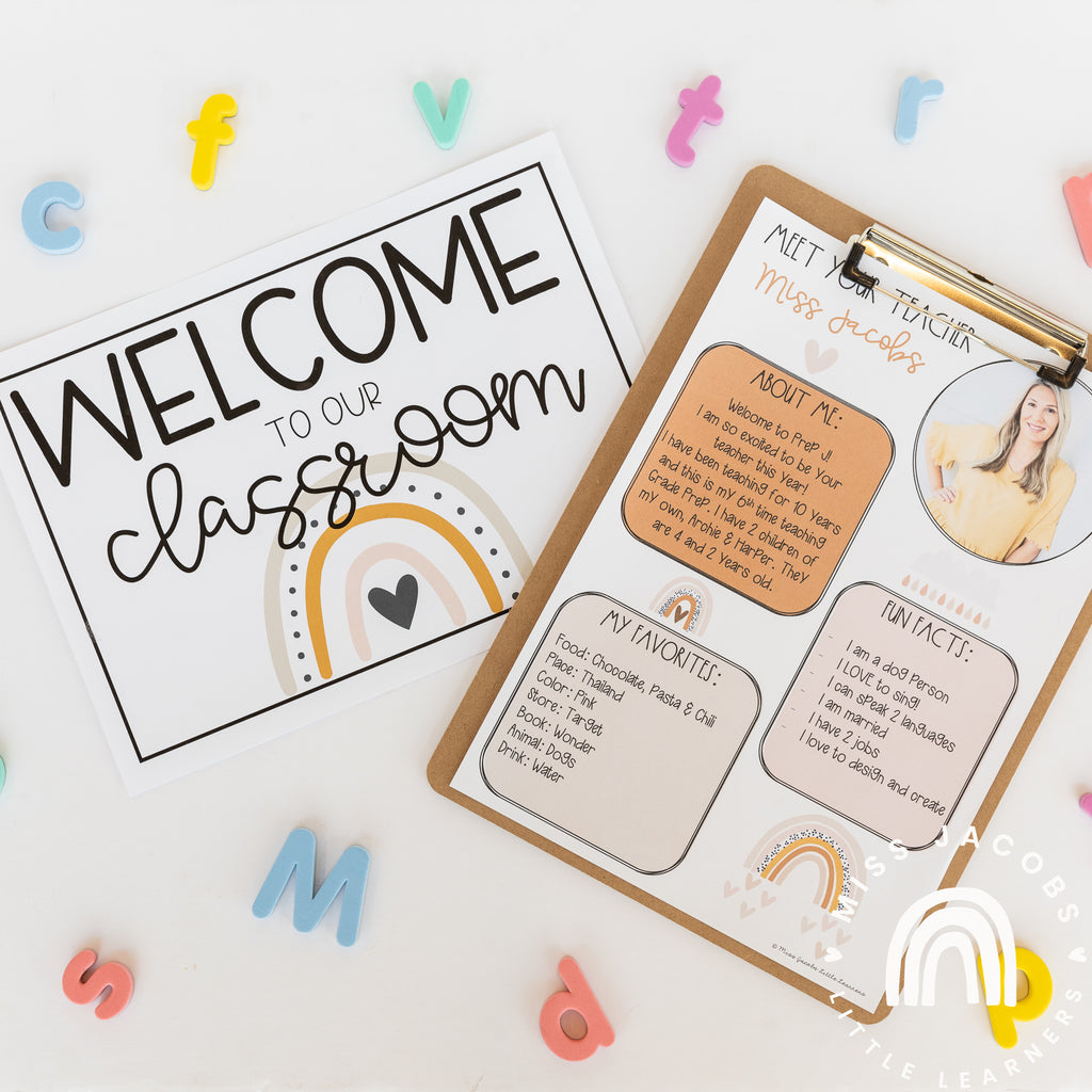 A clipboard contains a Meet the Teacher sheet, with coloured text boxes and a Boho Rainbow in neutral colours. A sign that reads ‘Welcome to our Classroom” also contains a Boho Rainbow. Coloured letter shapes are scattered around the flatlay.
