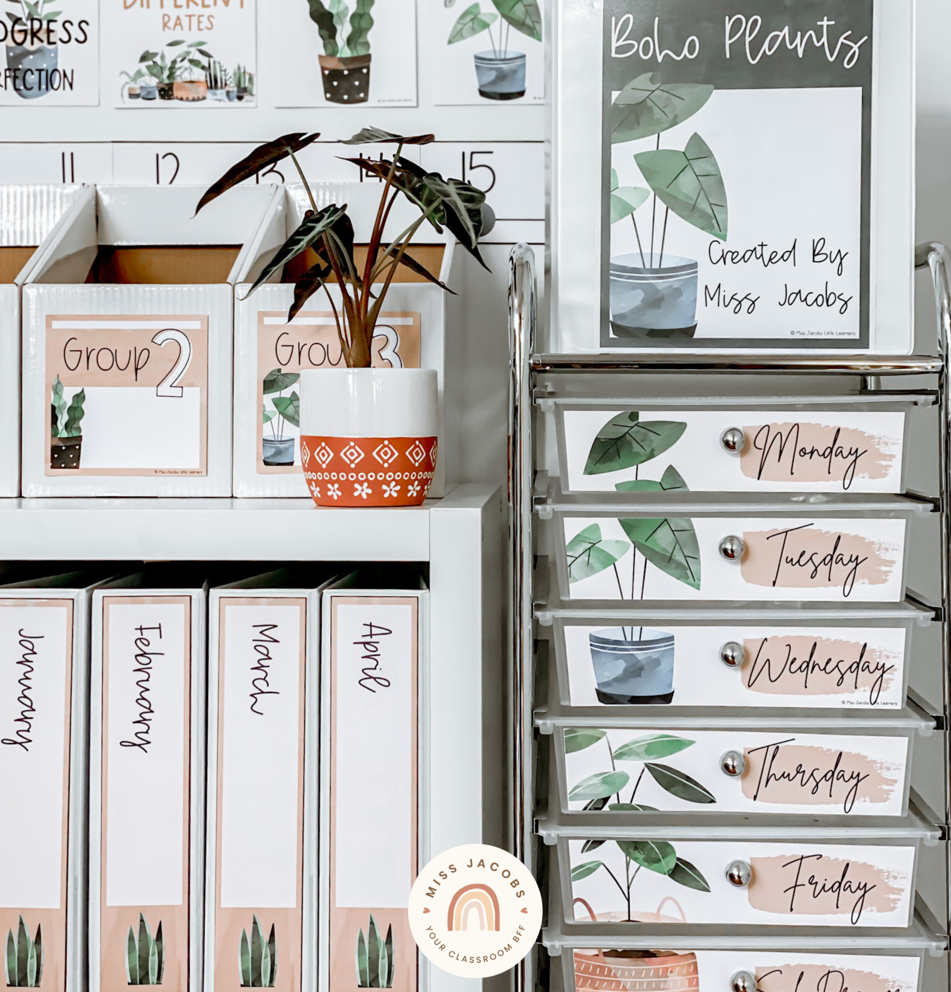 There are two images. In the first we see the top corner of a bookshelf, and inside are a series of the white binder with the Boho Plants labels. There’s an illustration of a plant on the base and handwriting font spelling out the months of the year. Next to the shelf is a trolley with drawers that also contain the Boho Plants labels. There are large plant illustrations that span across a number of the labels, which also feature the days of the week in cursive font. The right-hand image shows a closeup of a binder cover, it says ‘boho plants’ and features an illustrated pot plant with a blue pot and big dark green leaves. The heading is white handwriting font against a black background.