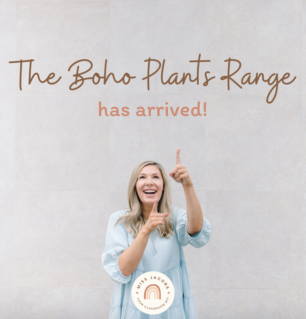 Chantelle stands in front of a large grey wall and points upwards. Over her head text reads, ‘The Boho Plants Range has arrived.’ She’s wearing a blue dress and has long blonde hair.