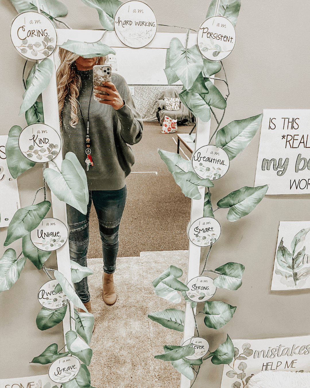 Three images show Botanical classroom displays bordering long mirrors. The displays include a number of motivational phrases and the mirror on the right is framed by a garland of faux leaves.