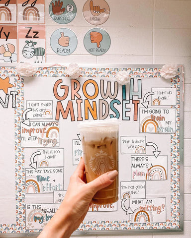 @lololoveslearning cheersing her iced coffee to her Boho Rainbow growth mindset display