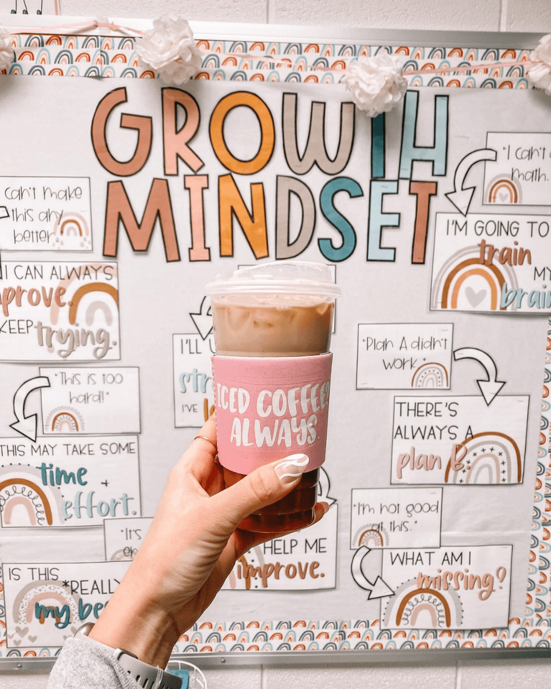 Two images show classrooms - one with an Affirmation Station around a gold mirror, and the second with a Growth Mindset Display - both from the Boho Rainbow range