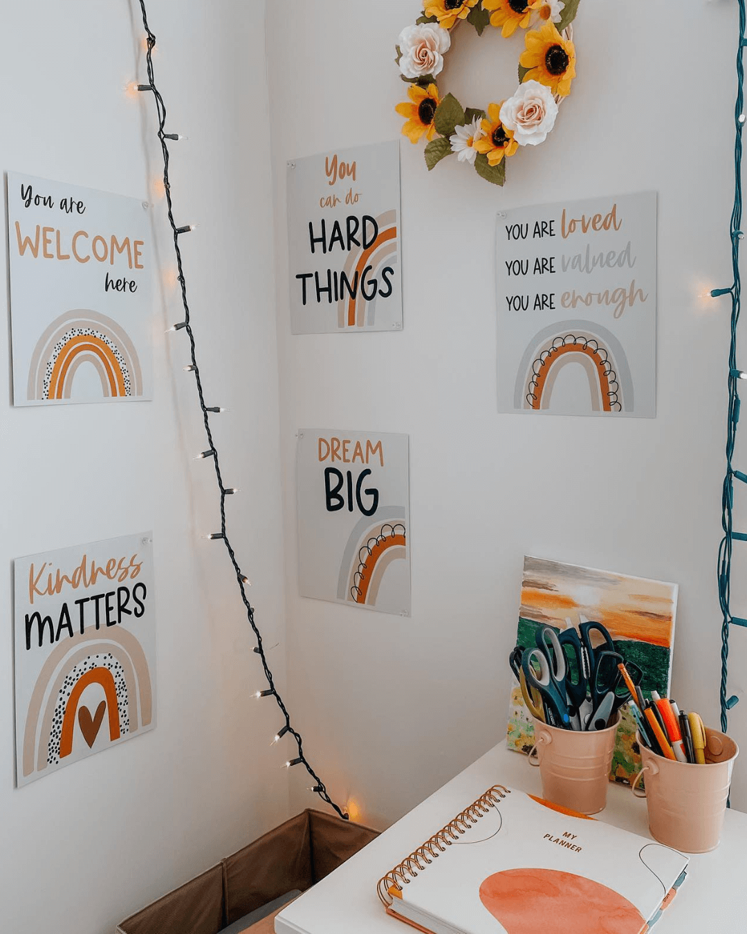 The left image shows a Growth Mindset display that Chantelle is creating, and the right shows a cosy corner of an office with motivational posters that say phrases like ‘dream big’ and ‘you are welcome here.’