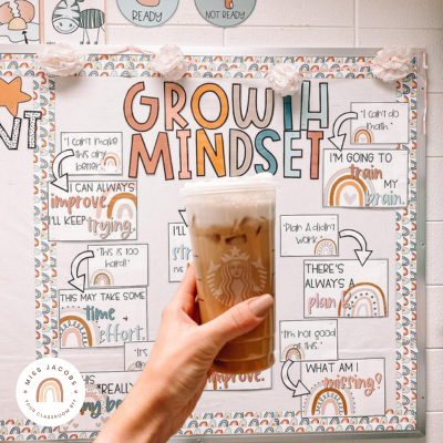 @lololoveslearning holding an iced coffee in front of her Boho Rainbow Growth Mindset Display.