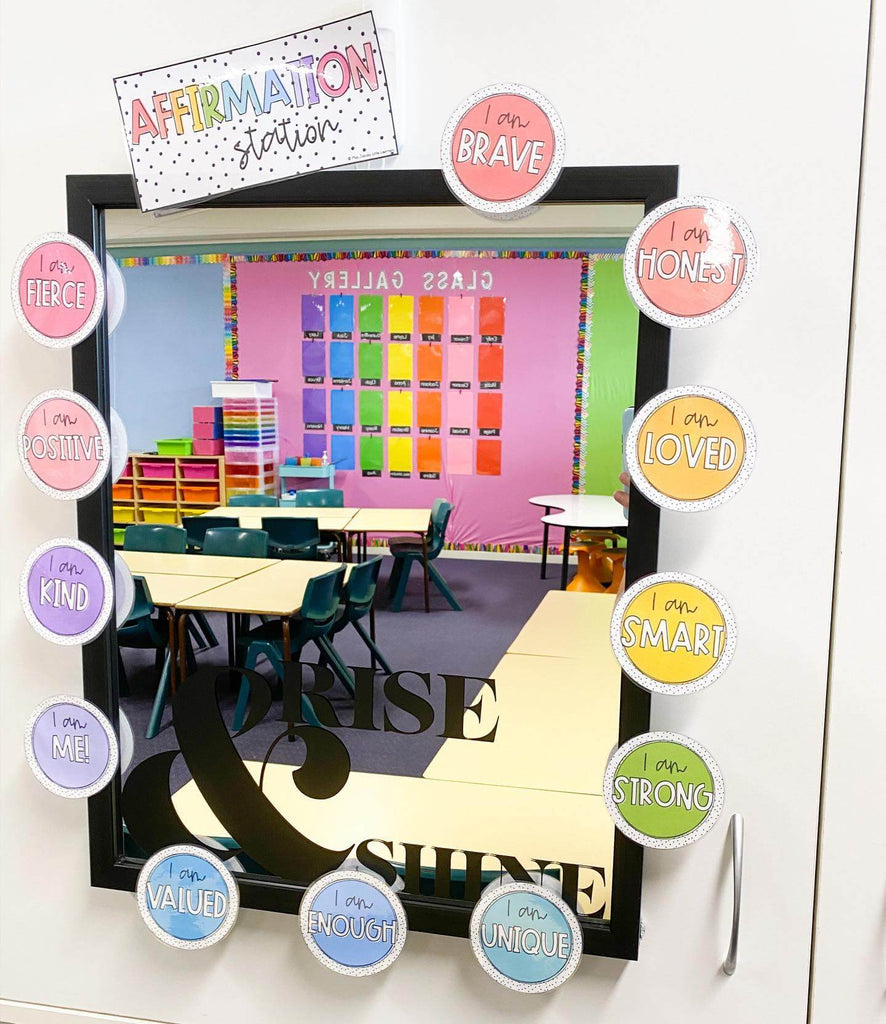 looking in a mirror at an affirmation station display in miss jacobs little learners spotty brights range. In the mirror we can see a reflection of a classroom with bright coloured decor in shelves and wall displays.