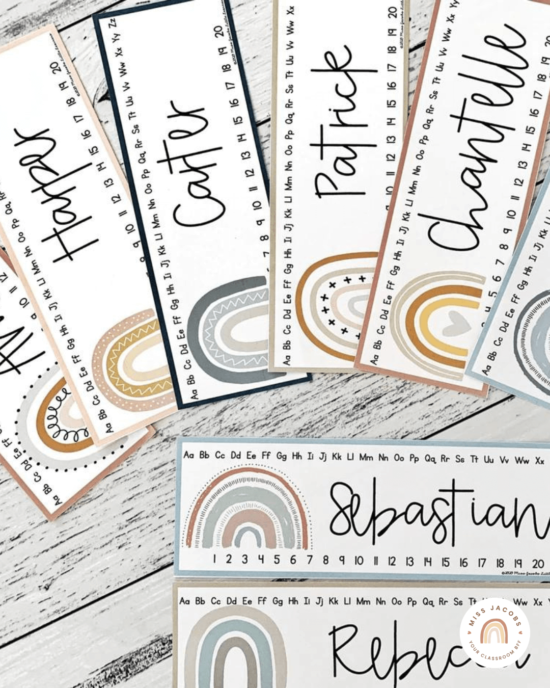 Two flatlay images show a range of name labels and welcome signs, all in earthy tones.” style=