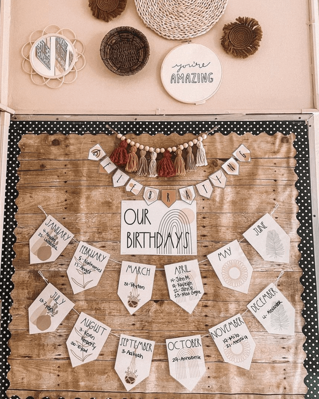 The left image shows a birthday display from the Boho Vibes range. It’s the months of the year in a bunting formation, pinned to a timber looking backing paper. The right image shows a wicker mirror with affirmation stickers affixed.” style=