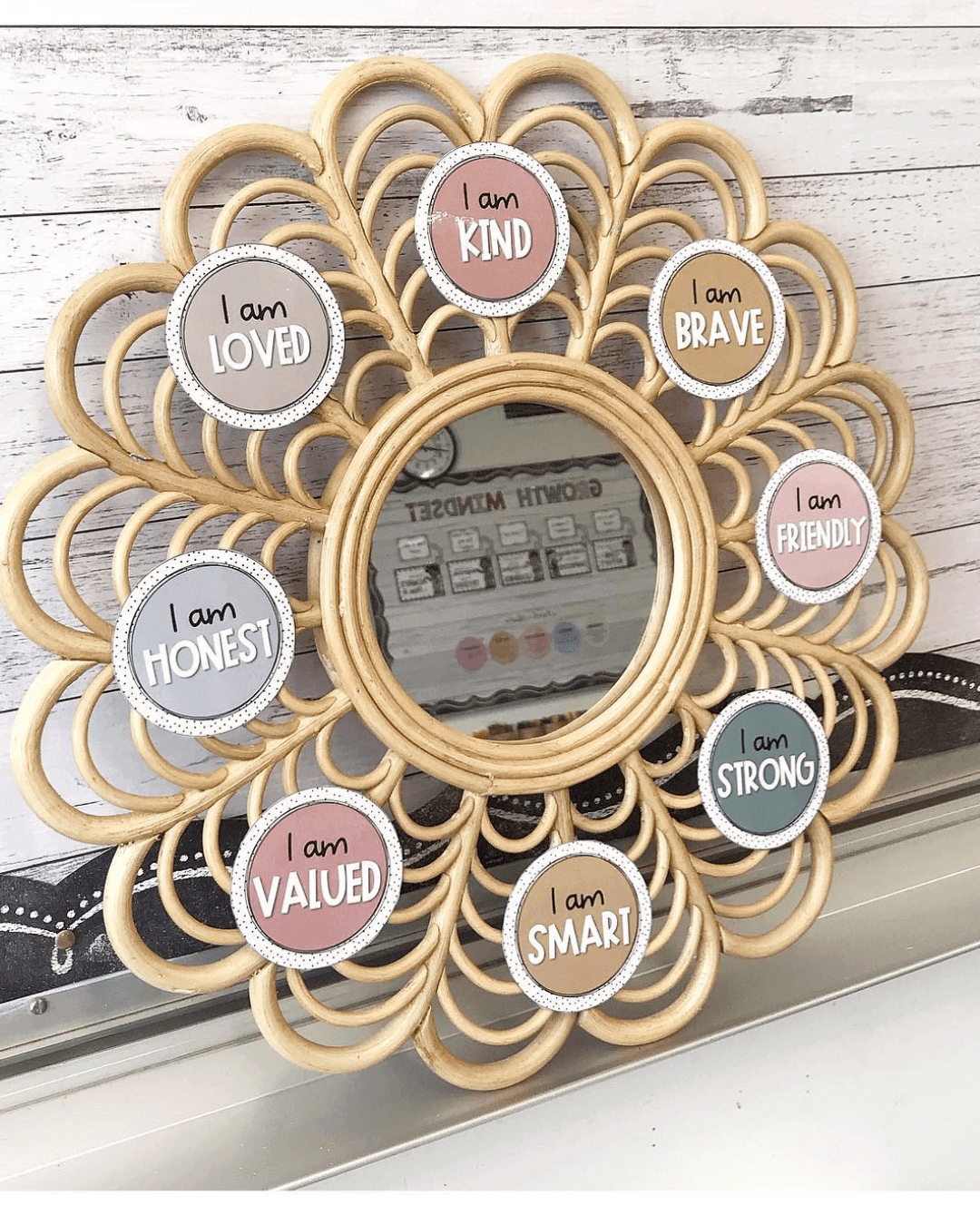 The left image shows a birthday display from the Boho Vibes range. It’s the months of the year in a bunting formation, pinned to a timber looking backing paper. The right image shows a wicker mirror with affirmation stickers affixed.