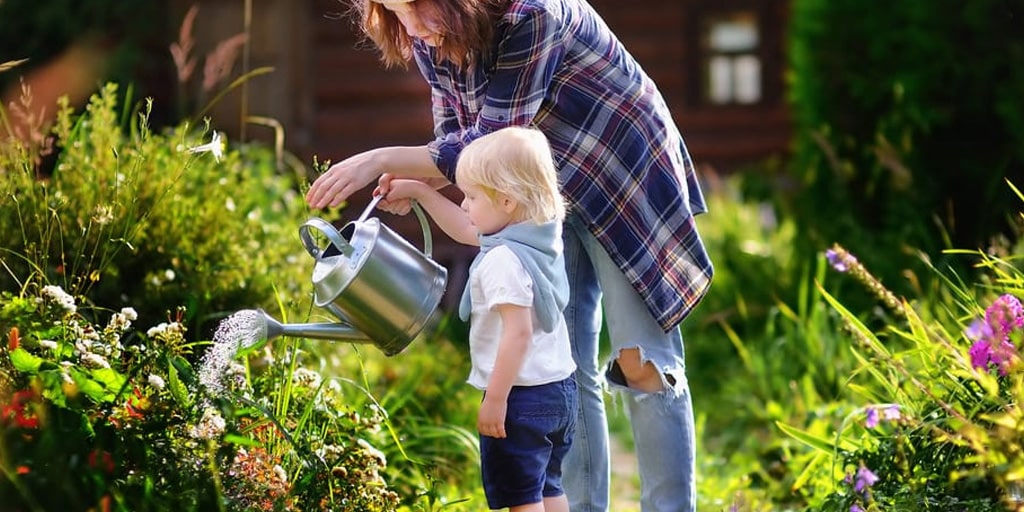 woman-and-child-watering-flowers