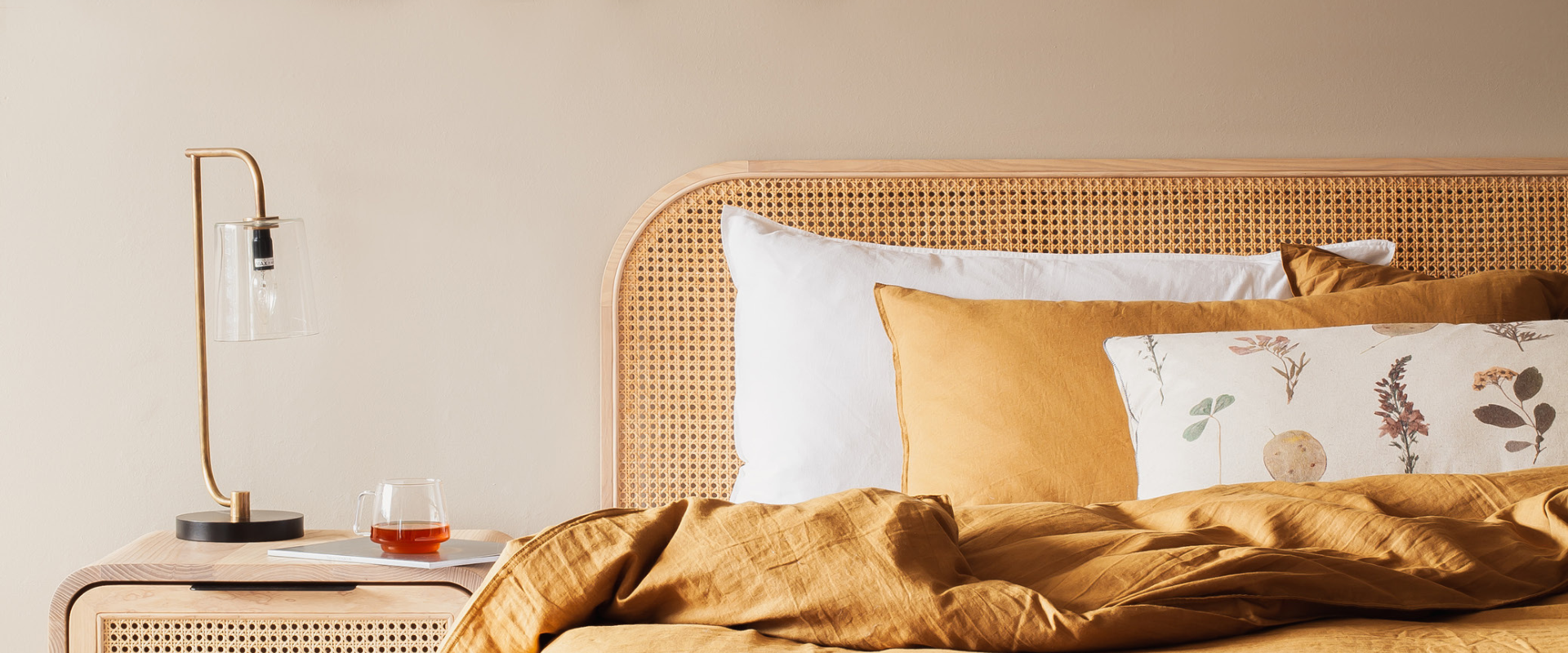 Fingerprint Interiors styled bedroom in warm earth tones with pops of pastel and artisan home decor