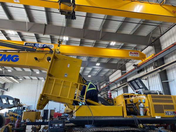 JAPA Machinery technician performing routine maintenance on equipment