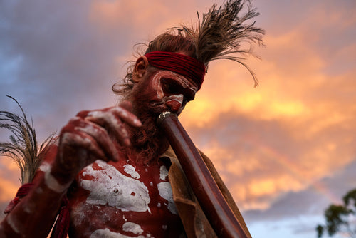 Aboriginal Man Playing the Didgeridoo