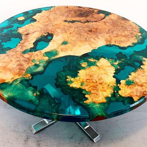 A round teal colored table made from bright burl, FlowCast®, and EcoPoxy Liquid Color Pigments.