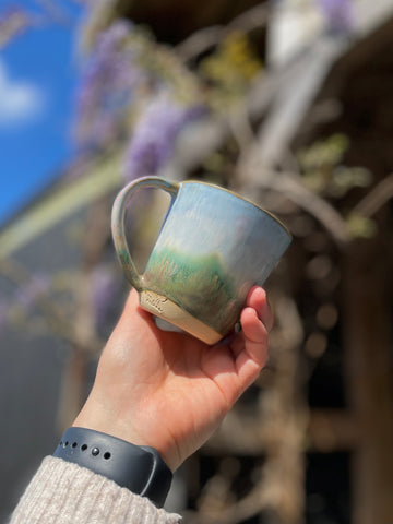 New ceramic mug, hand glazed with a landscape illustration