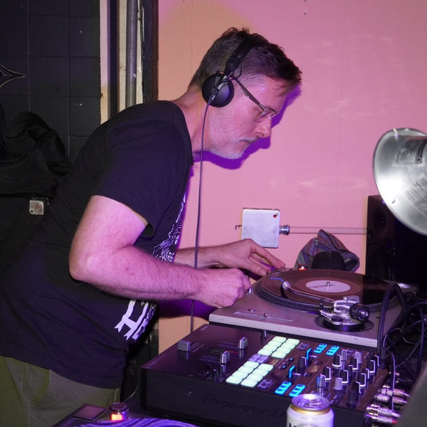 DJ Les Detrimental (Matt Thompson) spinning at Stork Club. Photo by Adam Gochnauer