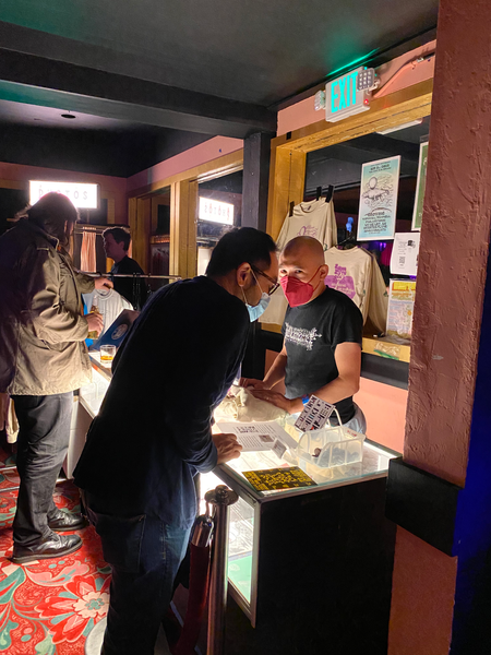 Stanley Lam visits George at the merch table. Photo by Yvonne Chen