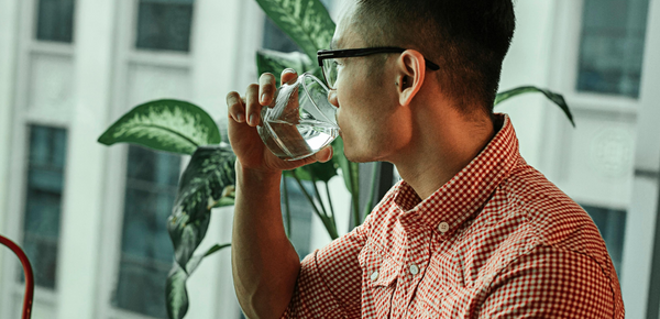 A man drinking a fresh filtered glass of water