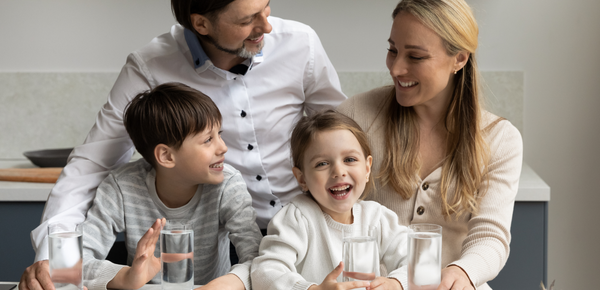 A family enjoying glasses of fresh filtered water
