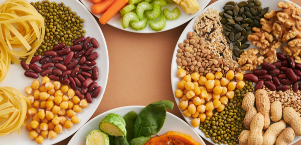 Plates of nuts, grains, beans and vegetables
