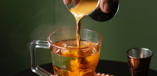 Coffee being poured into filtered water