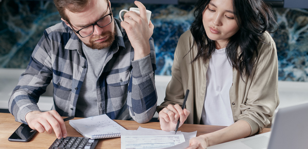 A couple looking over their energy bills