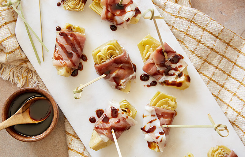 Image of prosciutto wrapped artichoke hearts