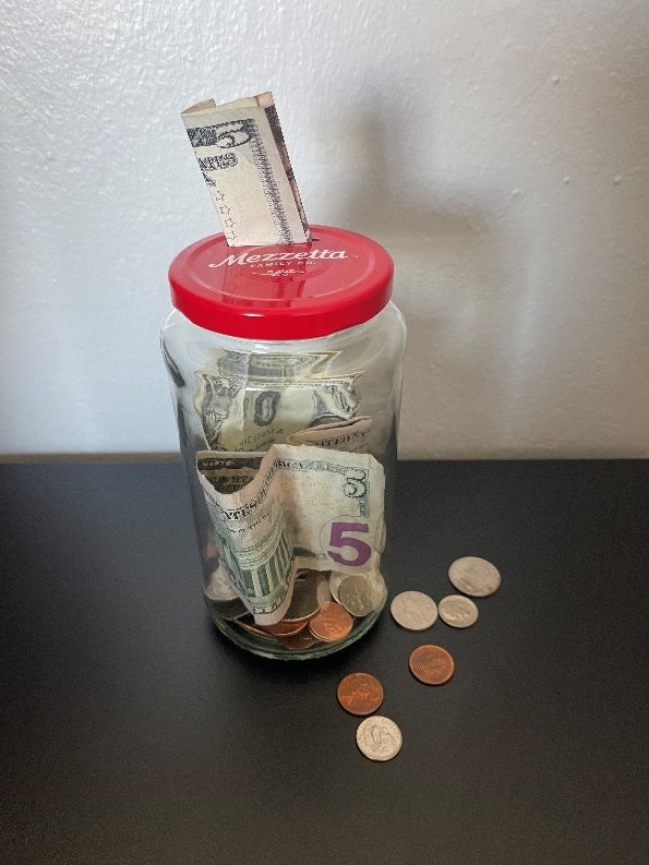 Mezzetta jars as a money jar