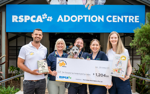 An image of Katharina and Reiner presenting a cheque for $1200 to the RSPCA