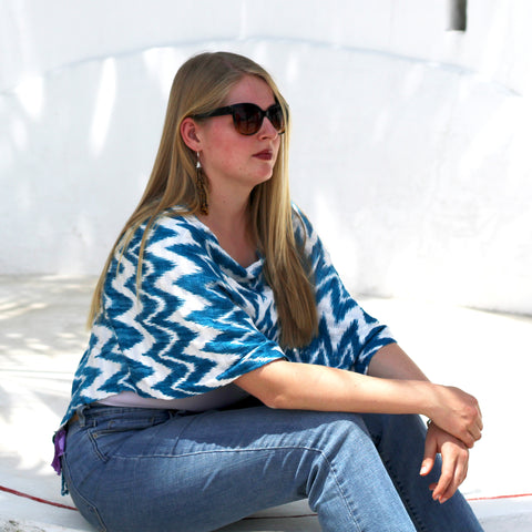 Woman wearing a Jaspe Poncho handmade in Guatemala.