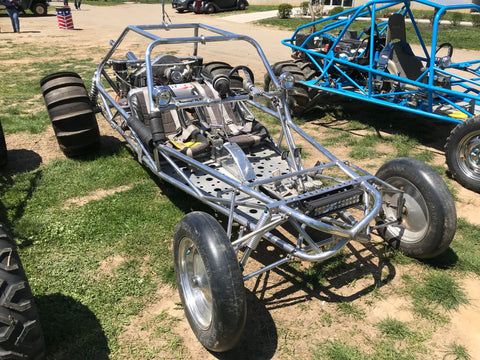 Picture of a mid engine sand rail with paddle tires