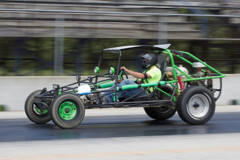 Dune buggy racing down the drag strip track