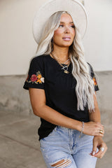 black tee with embroidered sleeves