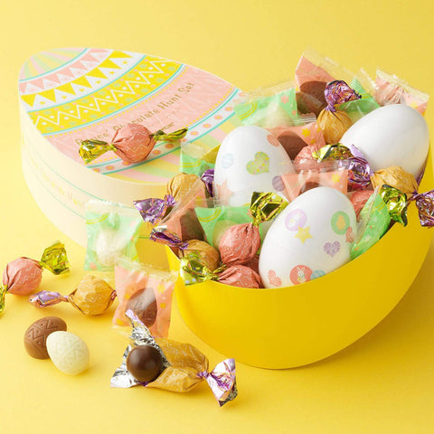 Image shows a yellow box with plastic eggs and chocolates.