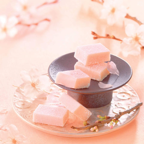 Image shows pink chocolate blocks on a plate.
