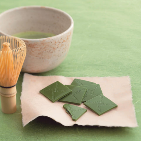 Image shows green tea chocolate squares on a plate.