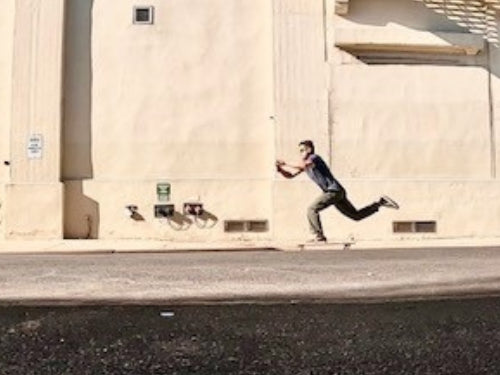 Longboarder Commuting on a longboard