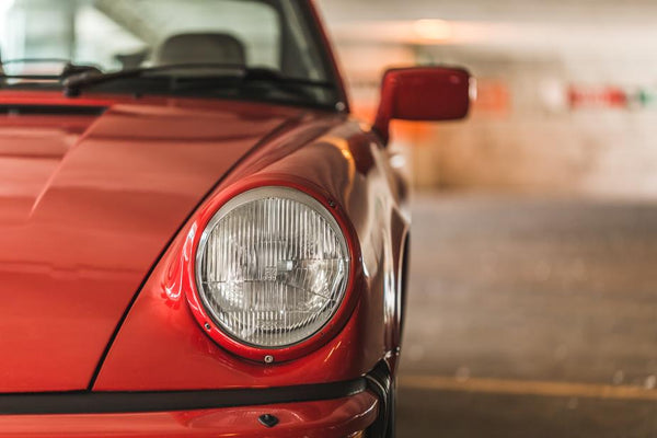 red-car-headlamp-closeup