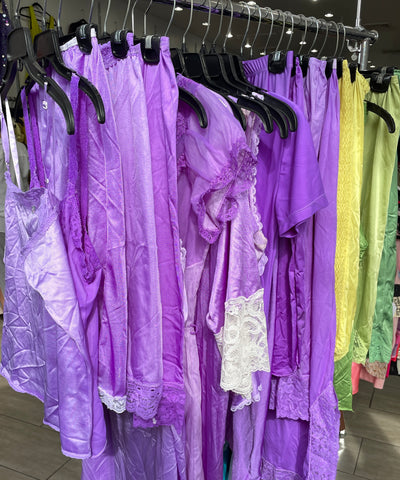 rack of hand dyed purple vintage lingerie dresses tops and slips