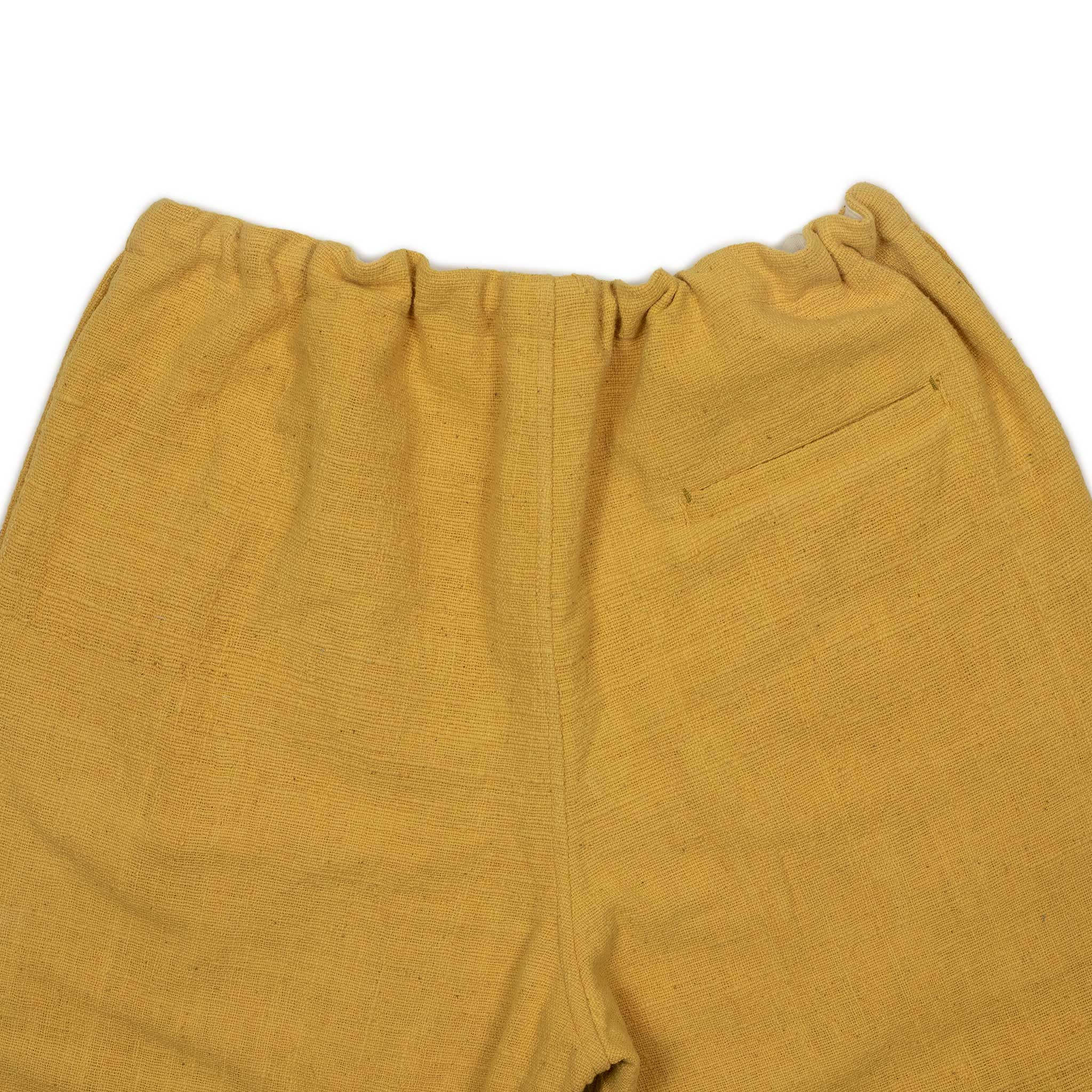 Drawstring tapered trousers in mango yellow cotton basketweave