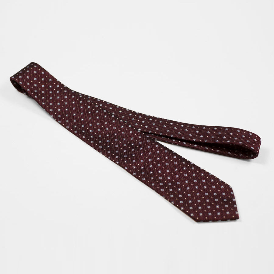 Burgundy woven silk tie, light blue and white neat motifs